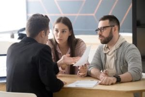 Couple discusses lawsuit with attorney