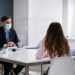 Lawyer discusses coronavirus lawsuit with couple