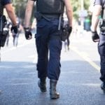 Three police officers walking in a line