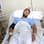 man with a catastrophic injury lying in bed