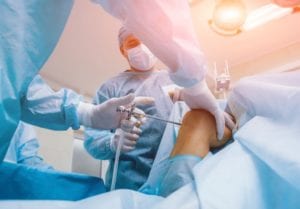 Doctors doing knee surgery